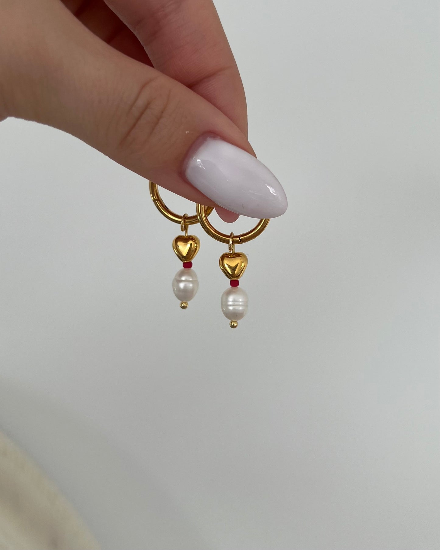 Mini golden heart earrings